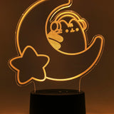 Orange neon light shaped with a crescent moon, star, and Pusheen the Cat wearing headphones.