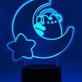 Teal neon light shaped with a crescent moon, star, and Pusheen the Cat wearing headphones.