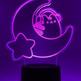 Pink neon light shaped with a crescent moon, star, and Pusheen the Cat wearing headphones.