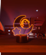 Orange LED light shaped with a crescent moon, star, and Pusheen the Cat wearing headphones.