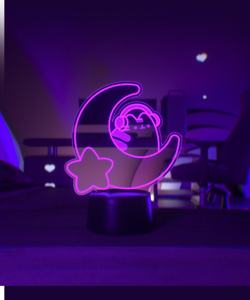 Pink LED light shaped with a crescent moon, star, and Pusheen the Cat wearing headphones.