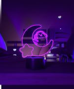 Pink LED light shaped with a crescent moon, star, and Pusheen the Cat wearing headphones.