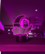 Pink LED light shaped with a crescent moon, star, and Pusheen the Cat wearing headphones.