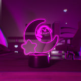Pink LED light shaped with a crescent moon, star, and Pusheen the Cat wearing headphones.