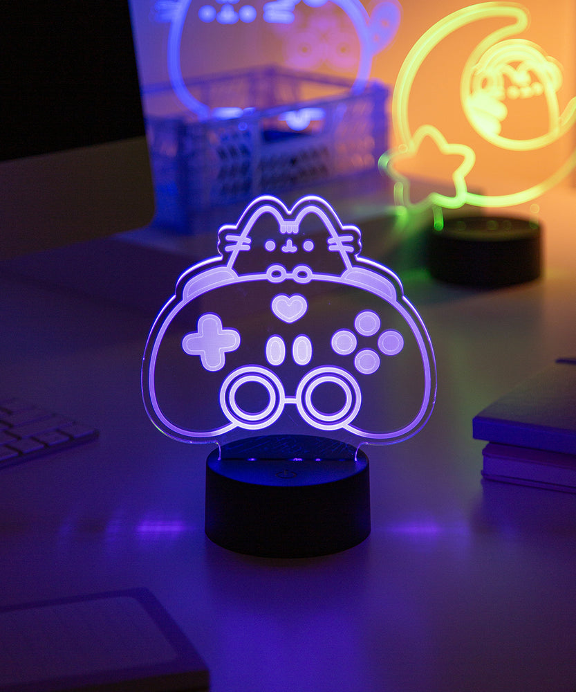 Purple Gaming-themed night light on a desk with blurred background.