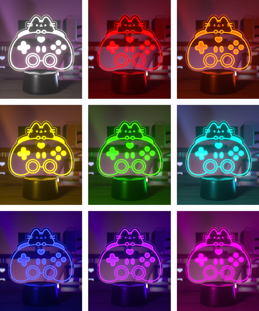 Color-changing LED lamp shaped like a gaming controller with a cat design on a dark background.