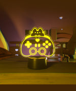 Yellow LED light shaped with Pusheen the Cat and a gaming controller.