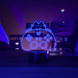 Neon sign of a cat-shaped gaming controller in a dark room.