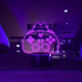 Pink LED light of Pusheen the Cat and a gaming controller.