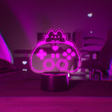 Pink LED light of Pusheen the Cat and a gaming controller.