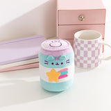 Gamer Pusheen Pop Sup Plush sits next to a coffee mug to demonstrate the size of the energy drink can inspired plush.
