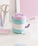 Side and back view of the Pusheen Pop Sip Plush. Pusheen's purple and blue striped tail colors match the lid and can elements on the plush toy. 