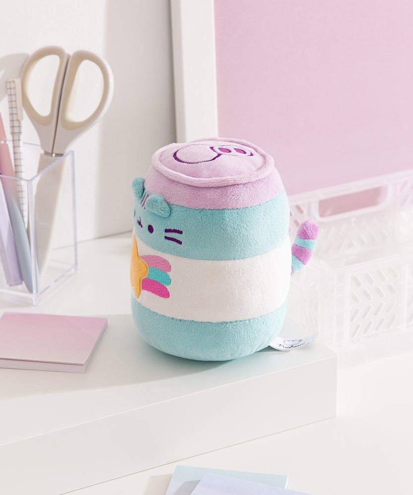 Side view of the plush. The blue and white stripes continue around the entire cylindrical plush. From this view Pusheen's striped tail can be seen extending off the back of the plush.