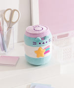 Energy drink plush has a shooting star graphic on the front with a yellow five-pointed star and purple, blue, and pink bursts coming off the right side of the star.