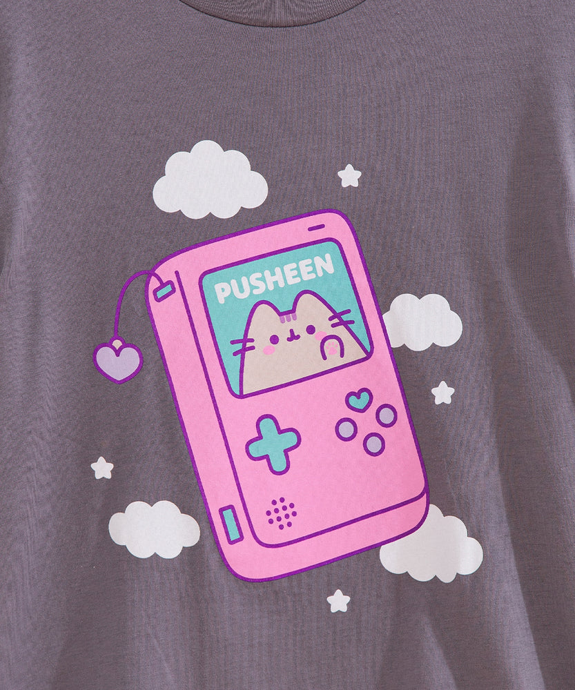 Close-up of the large graphic on the front of the Gamer Pusheen Retro Handheld Tee. Pusheen the Cat resides in a gaming console accented with pink, blue, and purple. 