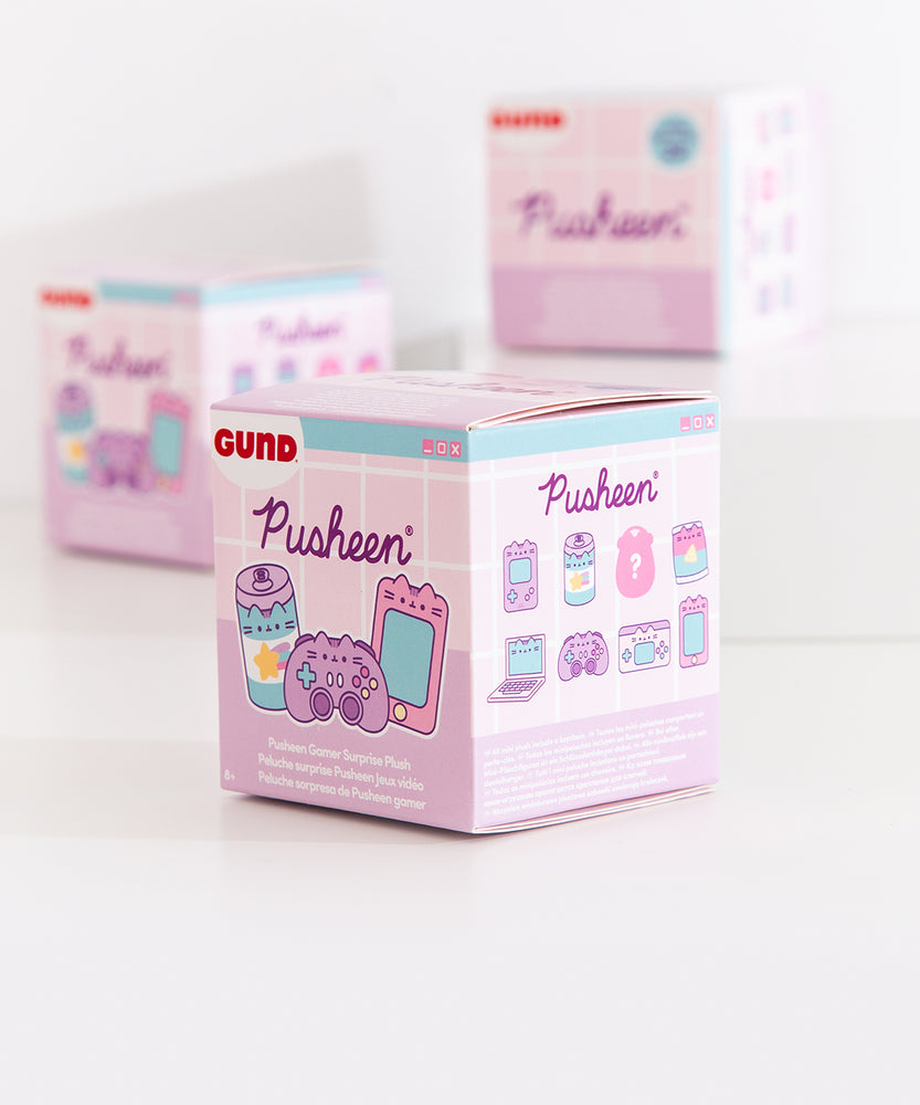Side view of the gamer blind box packaging. The side view features graphics of all the known plush keychain styles with a darkened graphic with a question mark indicating the mystery plush style of the Gamer Surprise plush collection. 