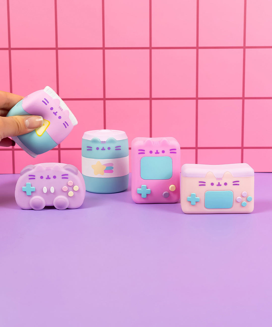All five gamer surprise squishies with a model squeezing the bag of chips to show the squishy nature of the surprise assortment.