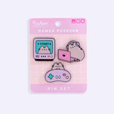 The gamer pin set is attached to a cardboard backing that is two-toned pink and has a white grid pattern in the center. At the top right of the card are three icons that mimic a browser screen. 