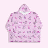 Gamer Pusheen Wearable Blanket Hoodie lies on a light surface. The oversized pullover has a hood, oversized sleeves, a large front pocket, and an all-over-print Pusheen the Cat with pink gaming controllers.