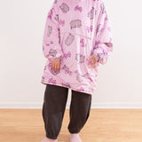Full view of the model wearing the Gamer Wearable Blanket pullover. The oversized sweater is long and one size fits most.