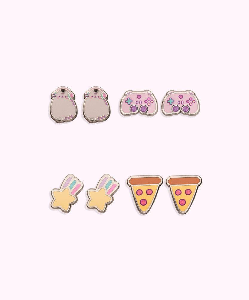 All earrings in Gaming Pusheen 4-Pack Stud Earrings Stud shown. From left to right and top to bottom, the stud earrings include Pusheen wearing headphones, a gaming controller, a shooting star, and pepperoni pizzas.  