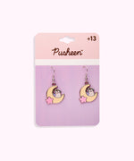 Gaming Pusheen Dangle Earrings on their cardboard backing card. The top half of the card has the Pusheen logo in brown on a light pink background and the bottom half of the card is purple. 