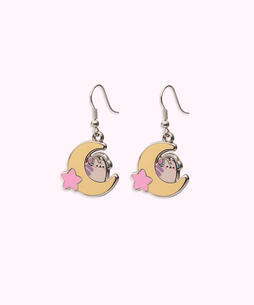 Gaming Pusheen Dangle Earrings on their cardboard backing card. The top half of the card has the Pusheen logo in brown on a light pink background and the bottom half of the card is purple. 