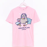 Gaming Pusheen Tee hangs on a light pink hanger in front of a white background. The graphic tee has a large print in the center of the t-shirt. 
