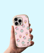 Model holds Pusheen Ice Cream Phone Case. The light-pink case has rounded rubber edges for bump protection. The iPhone case has an all over print of various Pusheen ice cream characters including an ice pop, snow cone, and classic scoop cone.  
