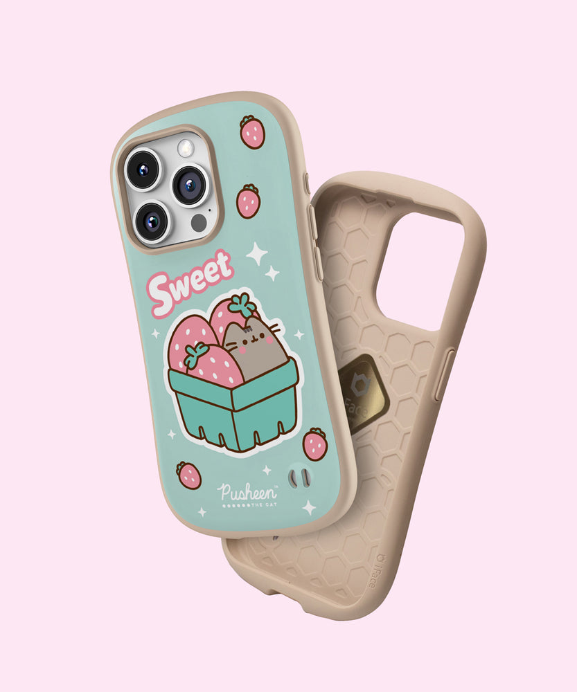 View of the outer shell and interior of the Pusheen Fruits Phone Case. The mint green case has a tan bumper and interior lining. The case also has a spot to add a phone charm in the bottom right corner.