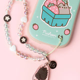Beaded phone charm is attached to the intended slot in the bottom right corner of the back of the Pusheen phone case.
