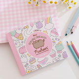 Front cover of pink and pastel Pusheen coloring book by Claire Belton.