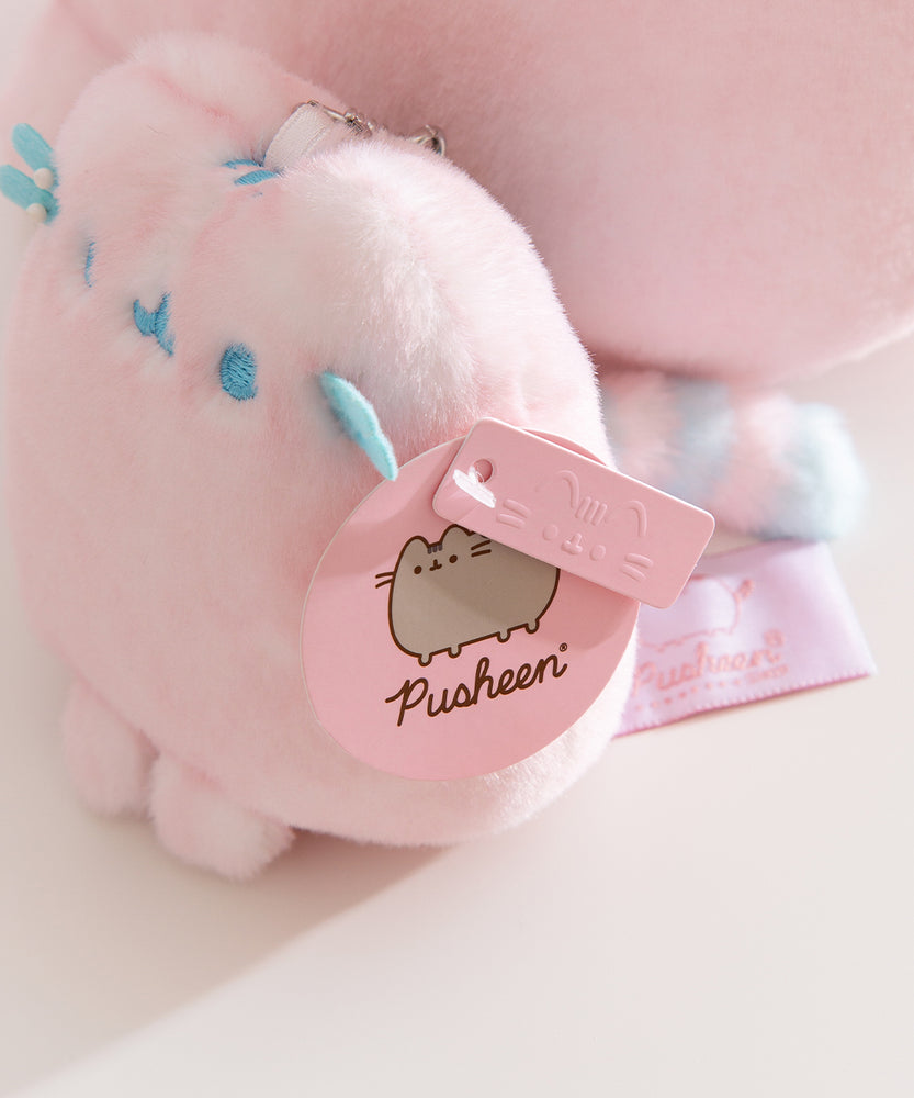 Close-up of the Pusheen Label hang tags that are attached to the side of the bag charm.