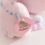 Close-up of the Pusheen Label hang tags that are attached to the side of the bag charm.