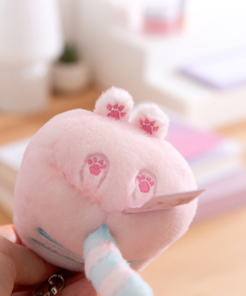 Plush toy with pink embroidered paw prints.