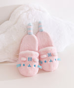 Close-up of the ears and face embroidery details on the Pink Dreamsheen Plush Slippers. 