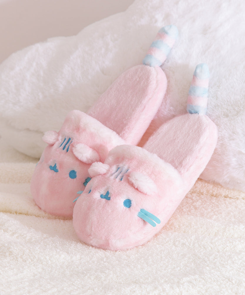 Side view of the fluffy plush slippers the dream-wash fabric is multi-hued pink.