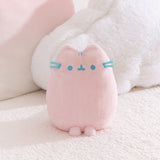 Pink plush toy with blue accents on a soft white background.
