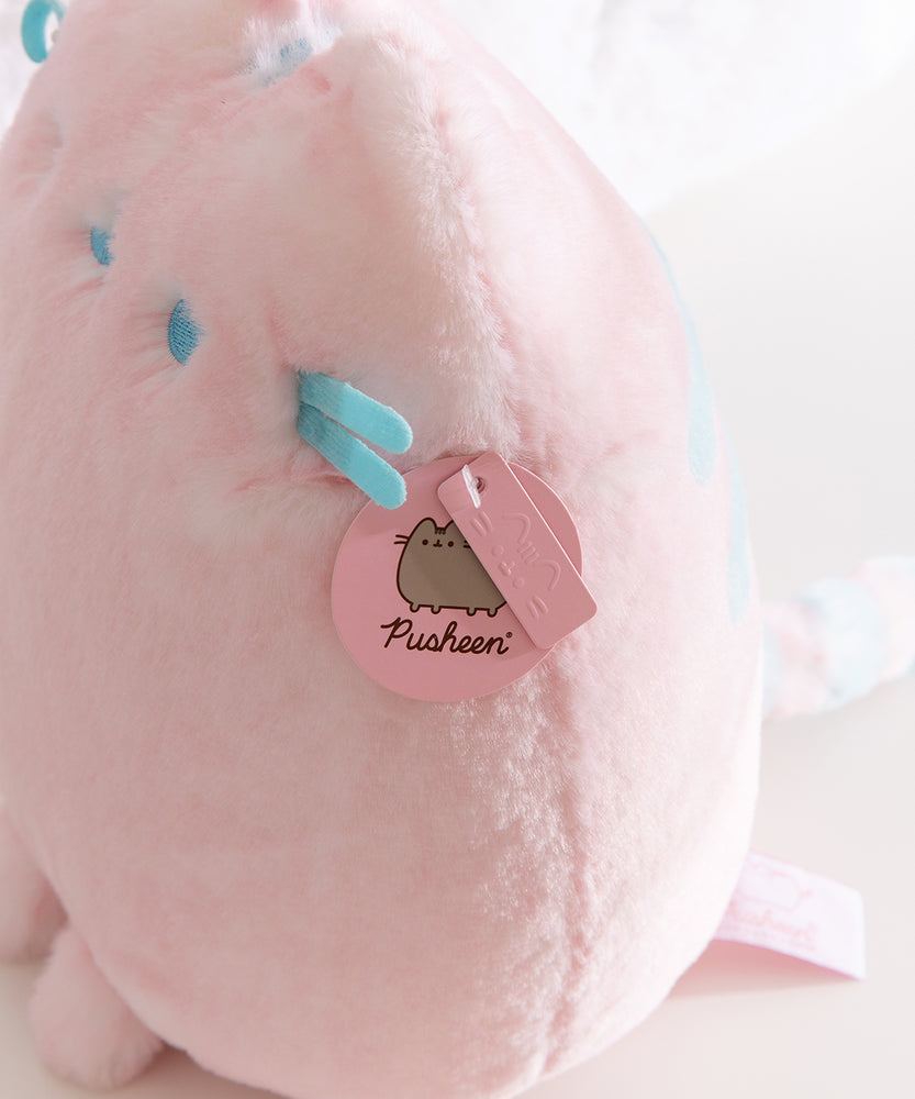 Close-up of the Pusheen Label tag that is attached near the side of the front whiskers. 