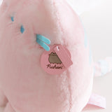 Close-up of the Pusheen Label tag that is attached near the side of the front whiskers. 