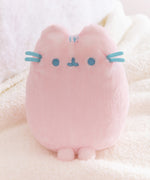 Close-up of the Pusheen Label tag that is attached near the side of the front whiskers. 