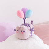 Pusheen 15th Anniversary Plush sits atop a cloud pillow. 