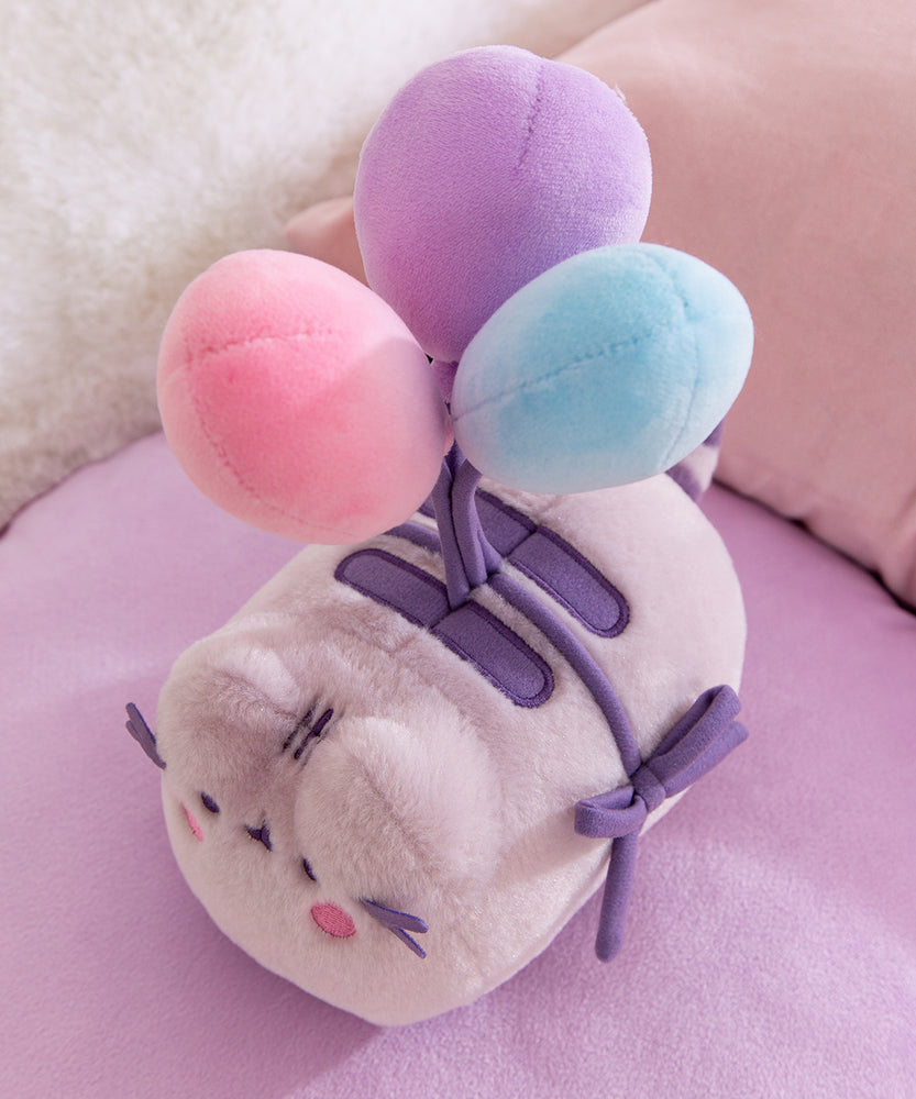 Close-up of the three multi-colored balloons on the 15th Anniversary Pusheen Plush.