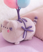 Close-up of the side tie detail that holds the balloons to Pusheen the cat.