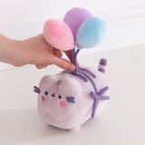 Model holds balloon strings on 15th Anniversary Plush to showcase the size and scale of the plush toy.