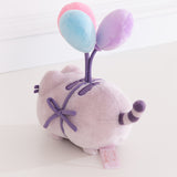 Back view of the anniversary plush toy showing Pusheen's purple and light grey striped tail.