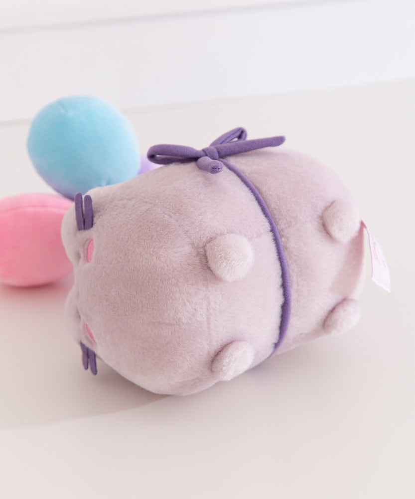 Close-up of the pudgy paws on the Pusheen cat plush.