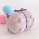 Close-up of the pudgy paws on the Pusheen cat plush.