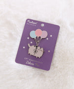 Pusheen 15th Anniversary Deluxe Pin on its purple and silver foil backer card. The backer card are foiled stars.