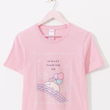 Light pink Pusheen tee hangs on a hanger. The fair-themed pink tee is apart of the Pusheen's 15th Anniversary collection.